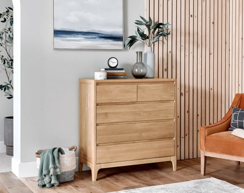 A chest of drawers-bedroom furniture-wooden chest of five drawers-storage basket-orange velvet chair